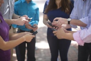 Millenials using their smartphones